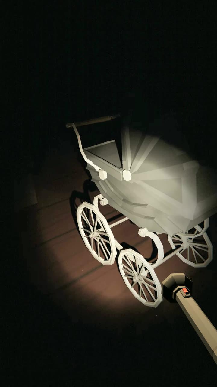 An old pram picked out by the torch in a dark mansion room